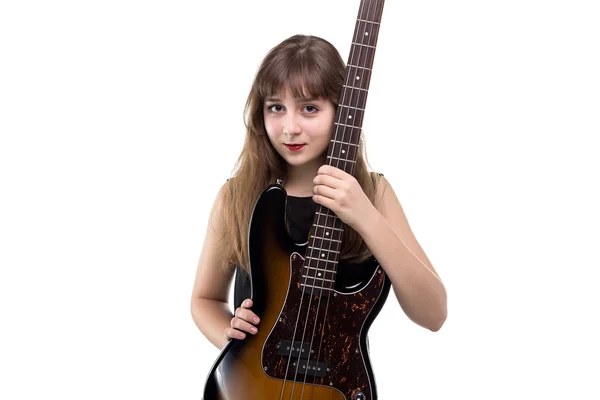 Menina adolescente feliz segurando uma guitarra — Fotografia de Stock