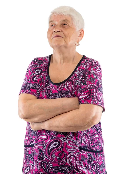 Mulher idosa com os braços cruzados olhando para cima — Fotografia de Stock