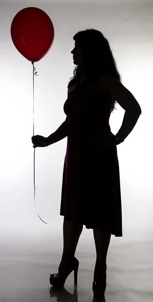 Woman with red balloon — Stock Photo, Image