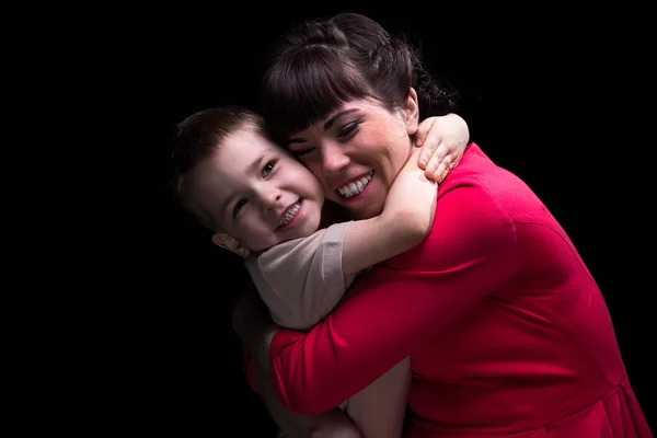 Happy hugging mother and son — Stock Photo, Image