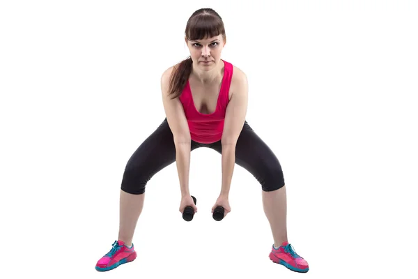 Meisje met kettlebell toont oefening — Stockfoto