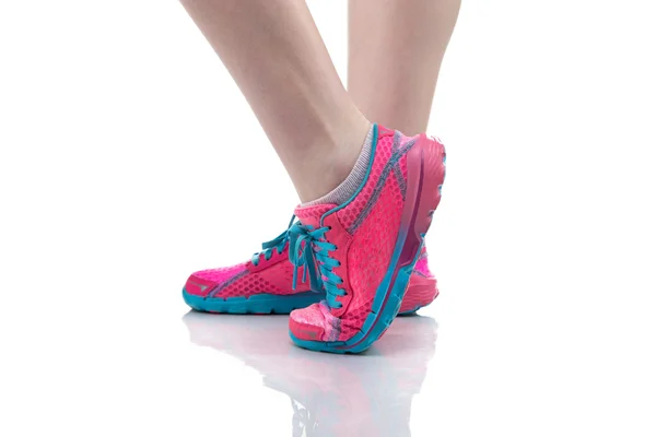 Womans feet in sneakers — Stock Photo, Image