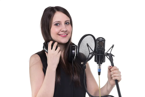 Smiling woman in headphones, recording of vocal — Stock Photo, Image