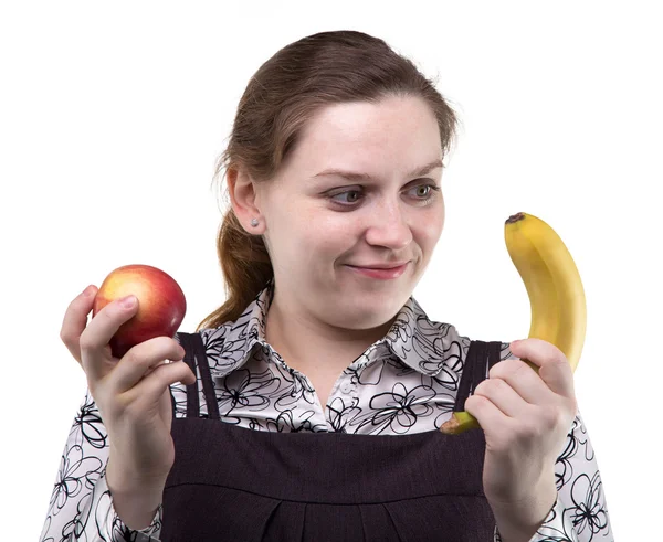 Blonde vrouw met appel en banaan — Stockfoto