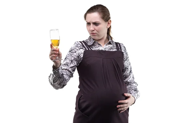 Pregnant young woman looking at drink — Stock Photo, Image