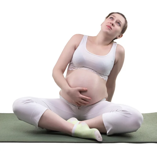 Femme enceinte rêveuse et yoga — Photo