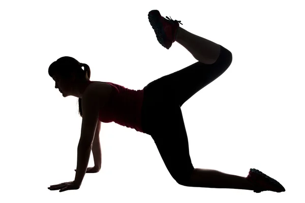 Silhouette einer sportlichen Frau, die Po pumpt — Stockfoto