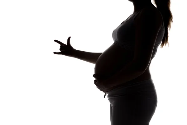 Silhouette della futura mamma che mostra le dita — Foto Stock