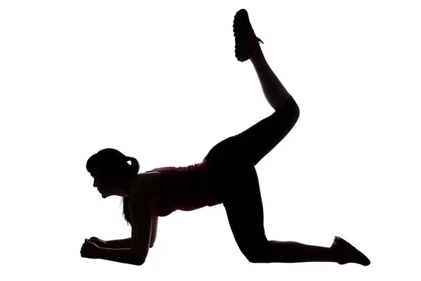 Silhouette of sport trainer with leg up — Stock Photo, Image