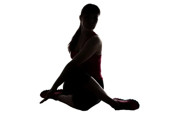 Silhouette of stretching sport coach — Stock Photo, Image