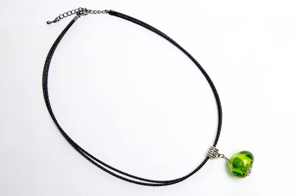 Accessory with green bead — Stock Photo, Image