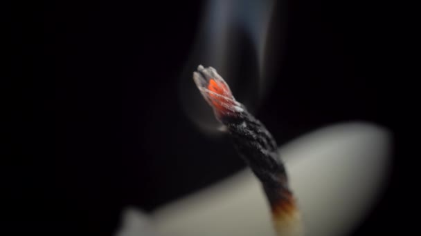 Video of smouldering wick on black background — Stock Video