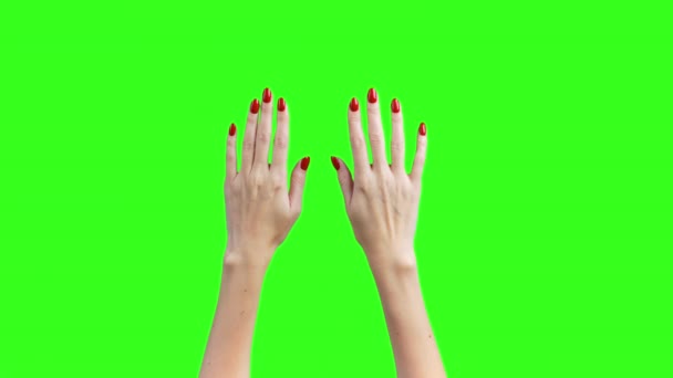 Shooting of angry female hands on green background — Stock Video