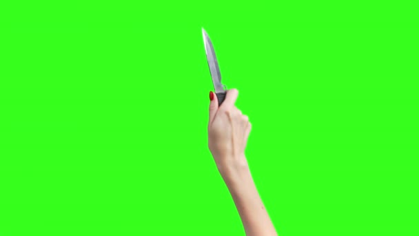 绿色背景下的女性手与刀的图像 — 图库视频影像