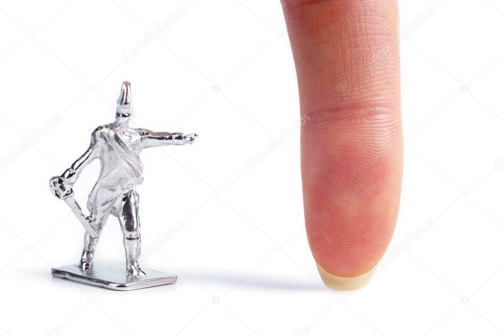 Shot of unpainted handmade metal soldier on white background