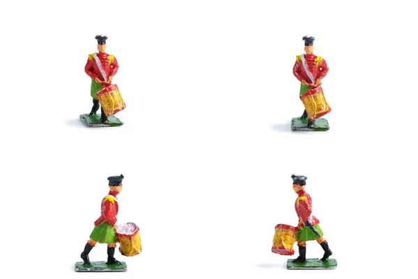 4 in 1 image of handmade tin soldiers with drum on the white background — Stock Photo, Image