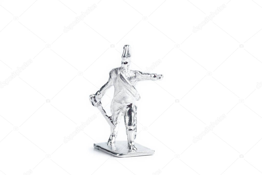 Photo of uncolored tin soldiers on the white background