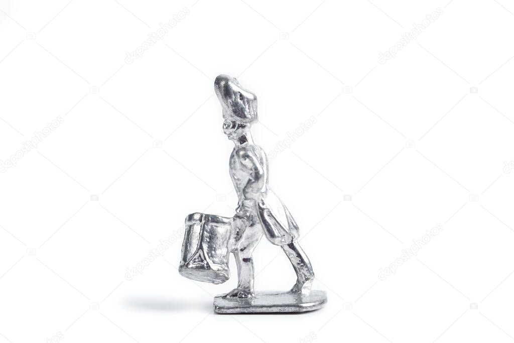 Photo of unpainted tin soldier on the white background
