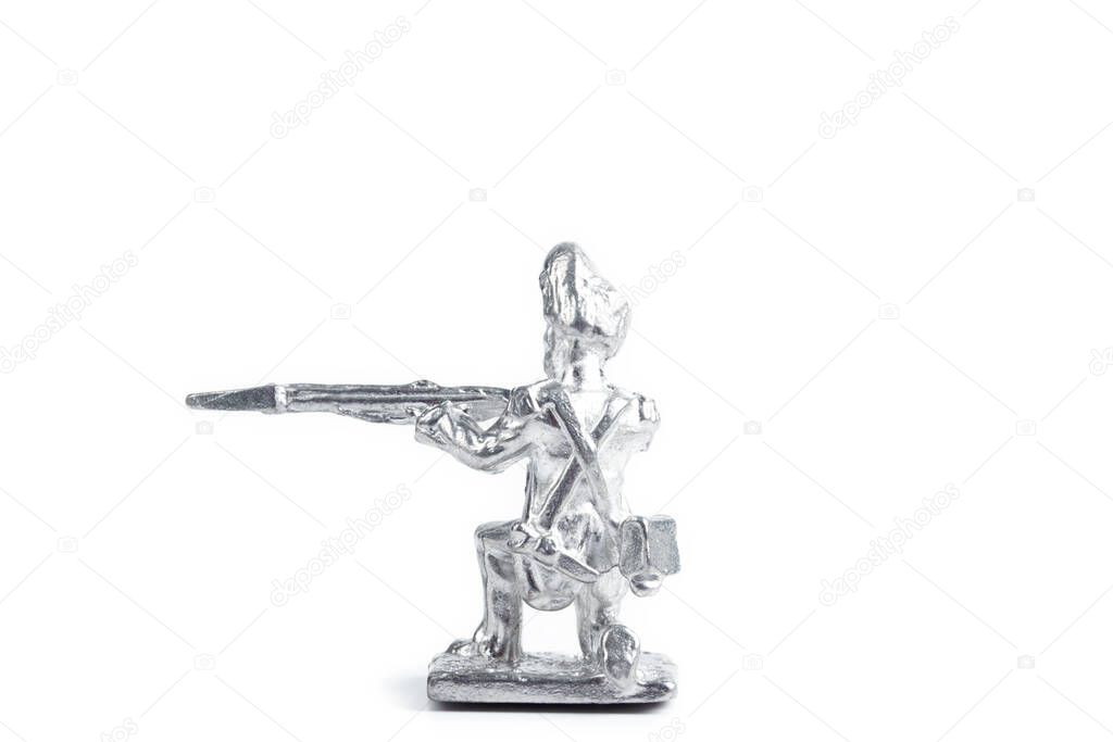 Shot of unpainted tin soldier on the white background