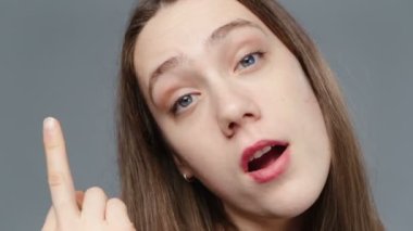 Video of young girl in black shirt with fuck finger, portrait