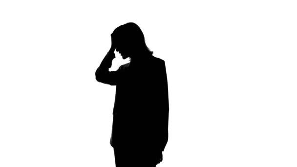 Video of womans silhouette in suit jacket with facepalm gesture — Stok video