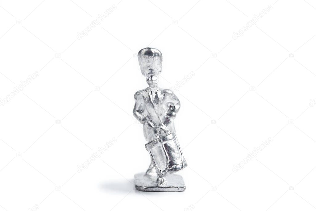 Image of handmade unpainted tin soldier on the white background