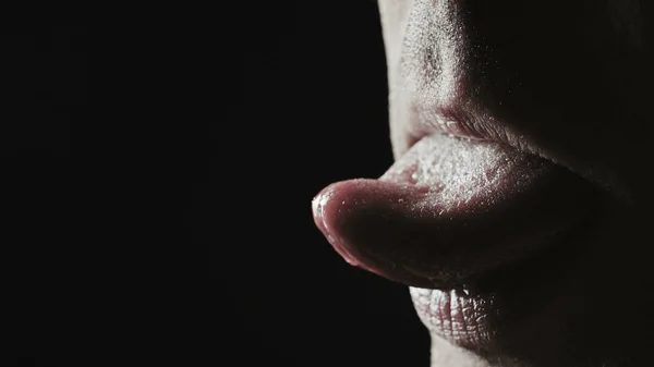Closeup photo of man grimacing with his tongue — Stock Photo, Image