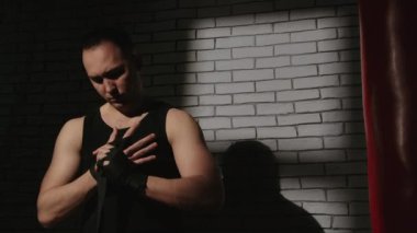 Shooting of man with black boxing bandages