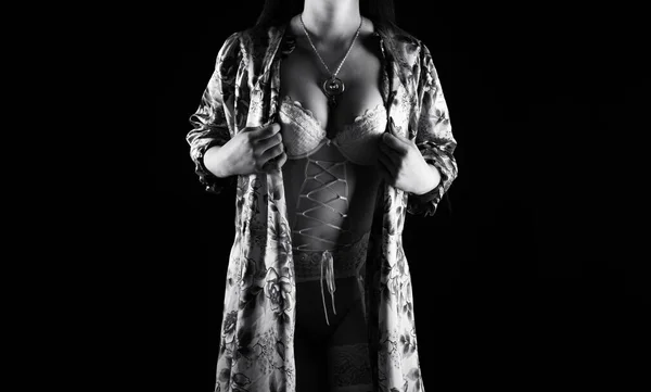 Black and white image of the adult woman in silk negligee — Stock Photo, Image