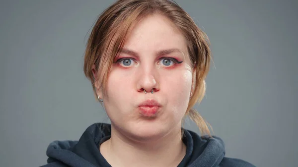 Photo of the grimacing stout woman, portrait — Stock Photo, Image