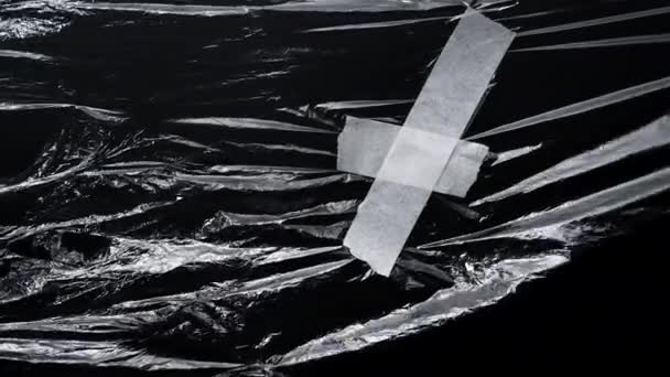 Vzor z plastového obalu s bílou páskou — Stock video