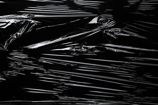 Siyah arkaplan üzerindeki polietilen ambalajının resmi Telifsiz Stok Fotoğraflar