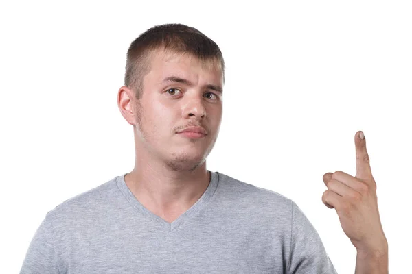 Retrato de un joven con cerdas mostrando el dedo índice hacia arriba —  Fotos de Stock