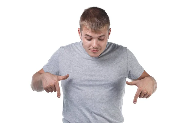 Photo of young man with bristle showing forefingers down — 图库照片