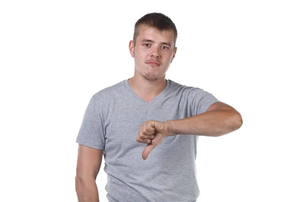 Photo of young man with bristle showing dislike gesture — 图库照片