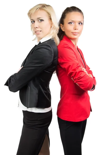 Two business lady standing back-to-back — Stock Photo, Image