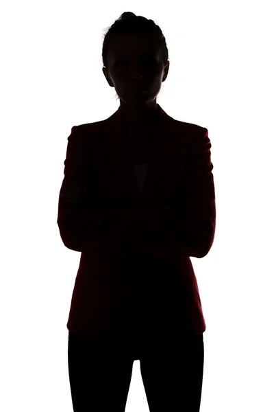 Silhouette of businesswoman with arms crossed — Stock Photo, Image