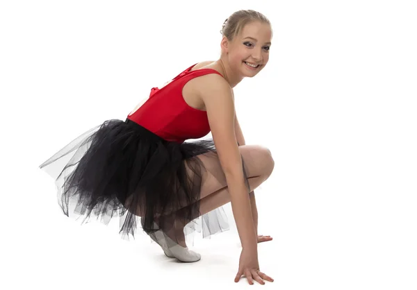 Yong ballerina sitting on haunches — Stock Photo, Image