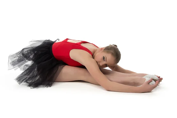 Young ballerina makes stretching exercises — Stock Photo, Image