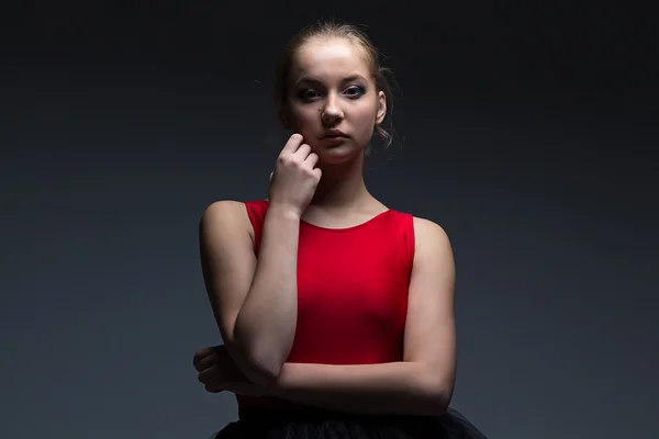 Girl with hand on her chin — Stock Photo, Image