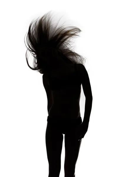 Form av dansande flicka med viftande hår — Stockfoto