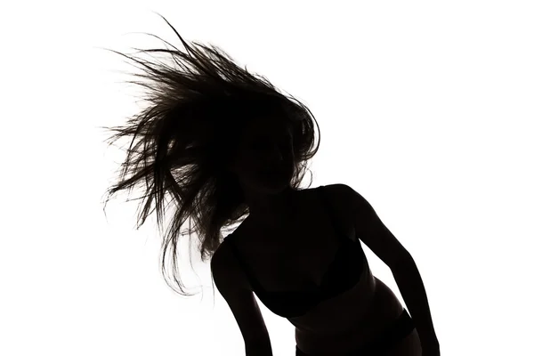 Form av flicka med långa viftande hår — Stockfoto
