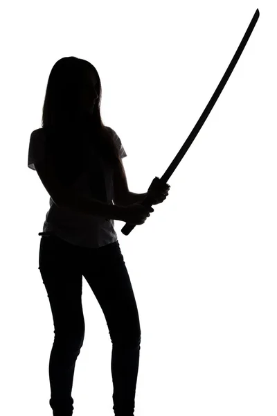 Silhouette of young woman with sword — Stock Photo, Image