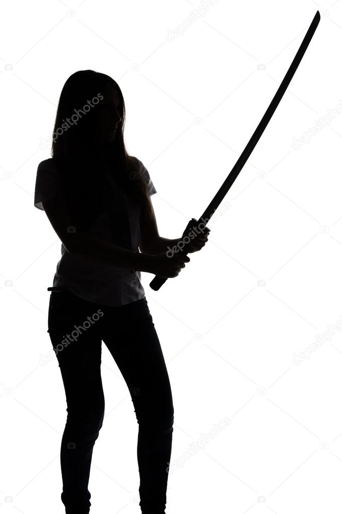 Silhouette of young woman with sword
