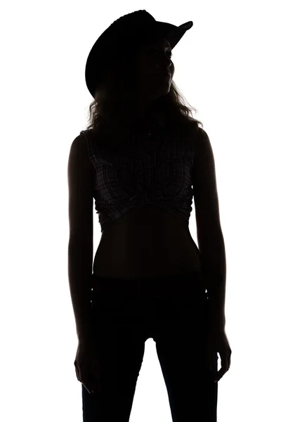 Silhouette of young woman in cowboy hat — Stock Photo, Image