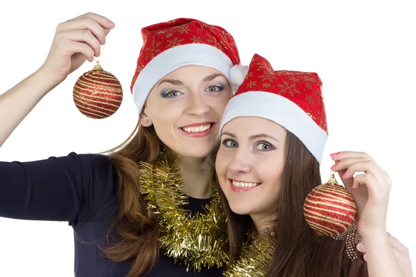 Foto de dos mujeres jóvenes en sombreros de Navidad — Foto de Stock