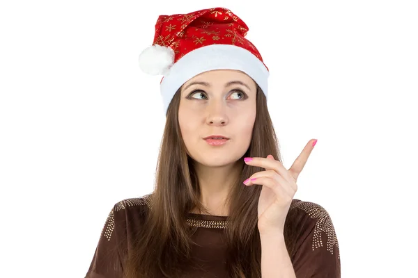 Foto einer denkenden jungen Frau mit Weihnachtsmütze — Stockfoto