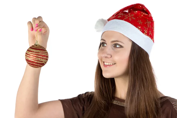 Foto de mujer joven mirando la bola de Navidad —  Fotos de Stock