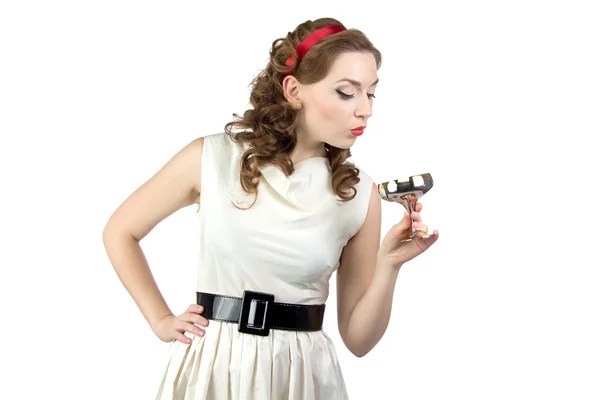 Photo of woman looking at metal snifter — Stock Photo, Image