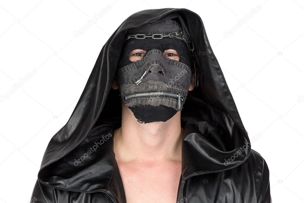Photo of the man dressed in hooded cloak